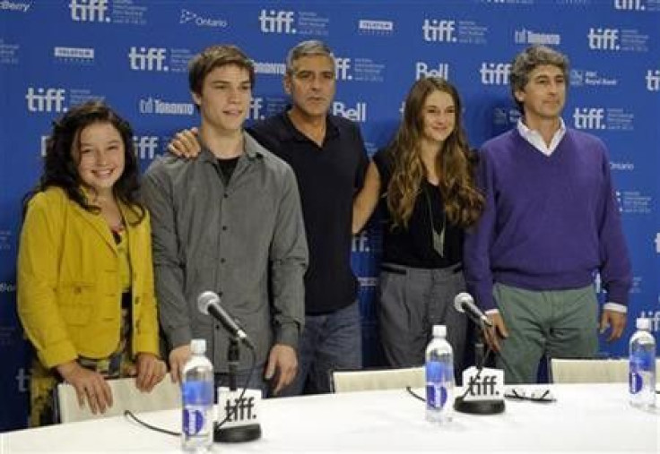 Cast members (L to R) Amara Miller, Nick Krause, George Clooney, Shailene Woodley and director Alexandrer Payne pose at the news conference for the film 'The Descendants' at the 36th Toronto International Film Festival