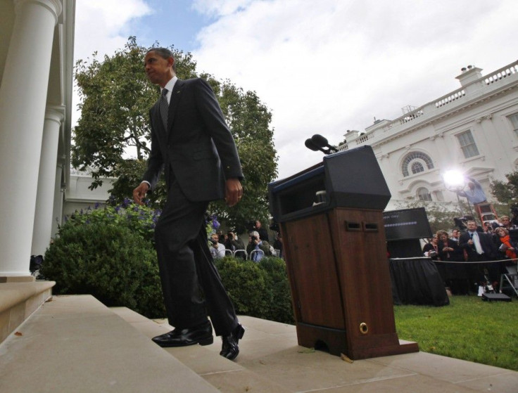 U.S. President Obama walks from the podium after making remarks following the death of Libya's former leader Gaddafi, in the Rose Garden of the White House in Washington