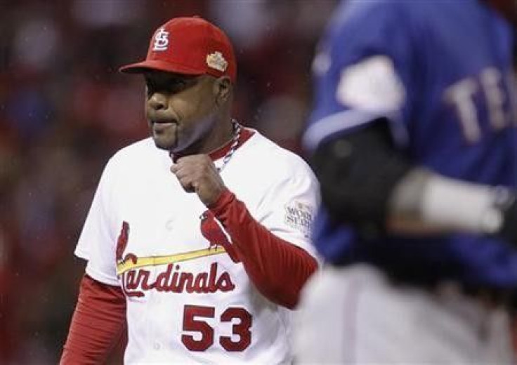 St. Louis Cardinals relief pitcher Arthur Rhodes celebrates getting Texas Rangers&#039; Josh Hamilton to pop up to end the 8th inning of Game 1 of MLB&#039;s World Series baseball championship in St. Louis, Missouri