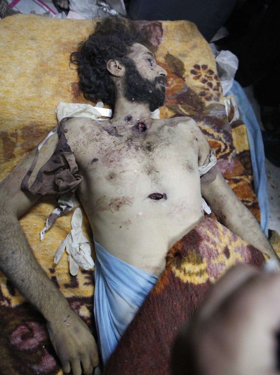 The body of Mo039tassim Gaddafi, son of Muammar Gaddafi, is seen in Misrata after being captured and killed during clashes with anti-Gaddafi fighters in Sirte October 20, 2011.