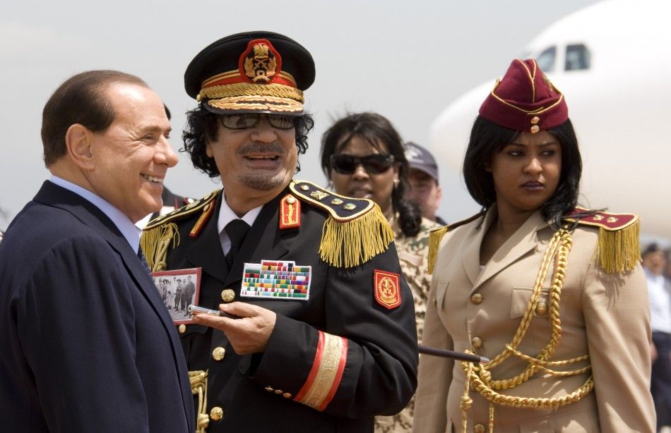 Muammar Gaddafi and Italy039s Prime Minister Silvio Berlusconi leave Ciampino Airport in Rome June 10, 2009
