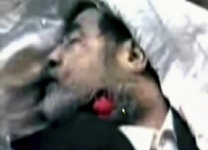 The body of former Iraq president Saddam Hussein appears in a frame from a new video posted on the Internet January 9, 2007. In the 27-second clandestine video, the body of Saddam Hussein is shown lying on a hospital trolley with a vivid red wound in his 