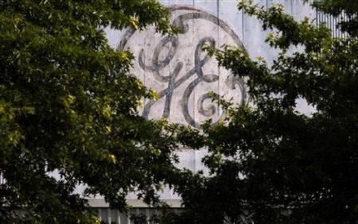 A faded, painted logo sits over the entrance to a General Electric Co. facility in Medford