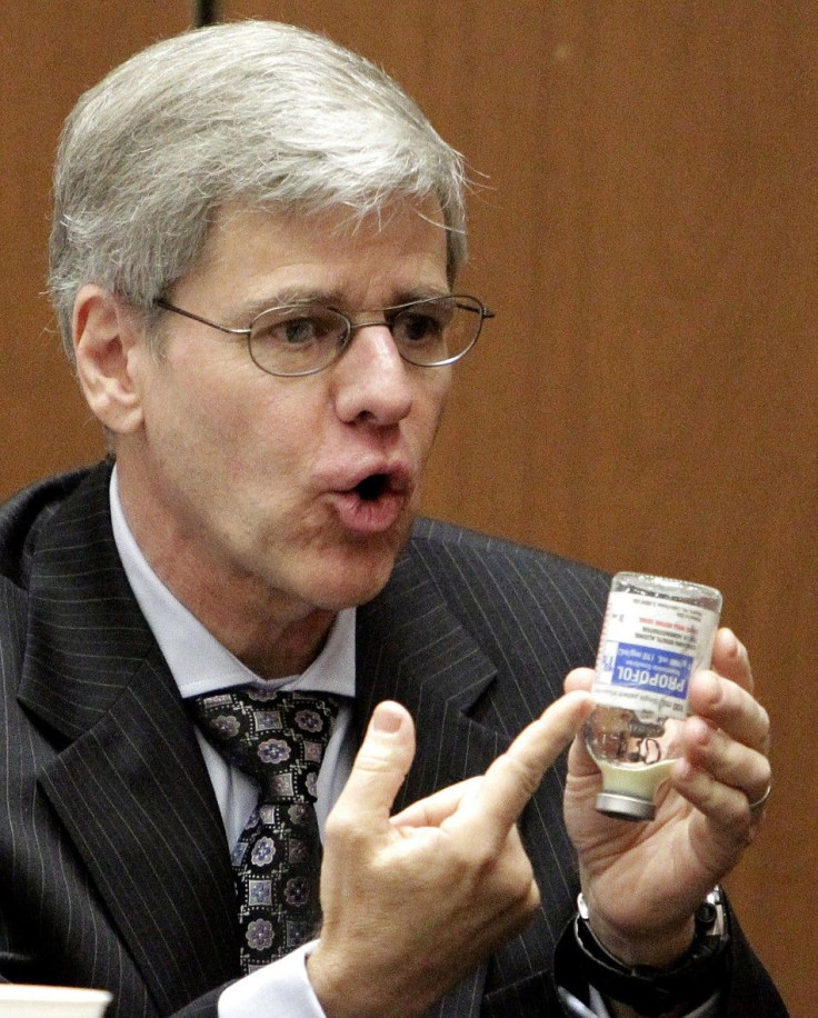 Anesthesiology expert Dr. Steven Shafer gestures to a Propofol bottle during Dr. Conrad Murray&#039;s involuntary manslaughter trial in Los Angeles