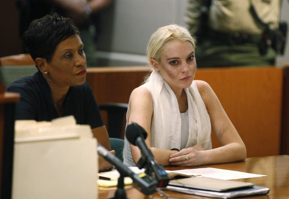 Lindsay Lohan sits during a progress report hearing at Airport Branch Courthouse in Los Angeles