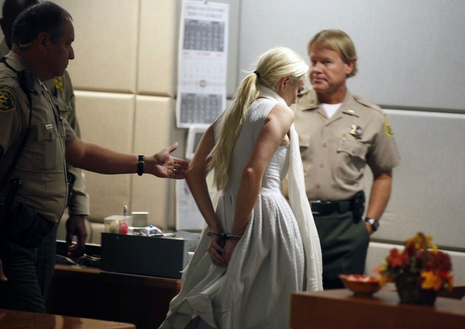 Lindsay Lohan is handcuffed after a judge revoked her probation for failing to appear at a series of community service appointments at the Downtown Womens Shelter at Airport Branch Courthouse in Los Angeles