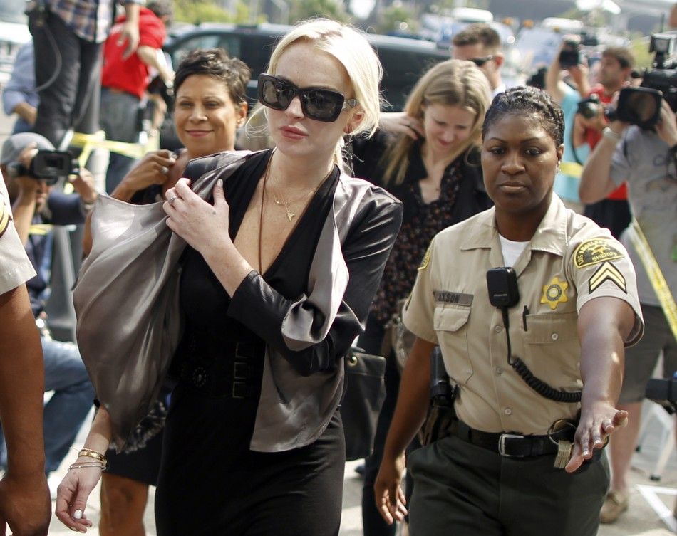 Actress Lindsay Lohan arrives in court for a compliance check to report her progress on 480 hours of community service she must do for shoplifting a necklace from a Venice jeweler, in Los Angeles