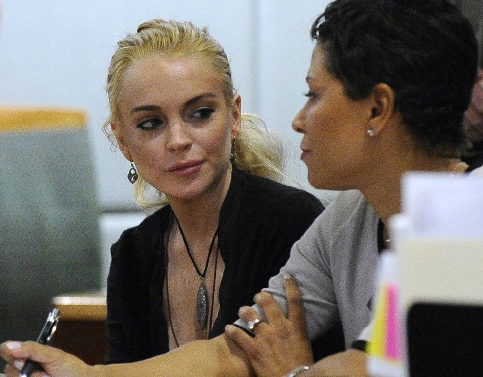  Actress Lindsay Lohan and her attorney Shawn Chapman Holley attend a preliminary hearing at the Airport Branch Courthouse in Los Angeles