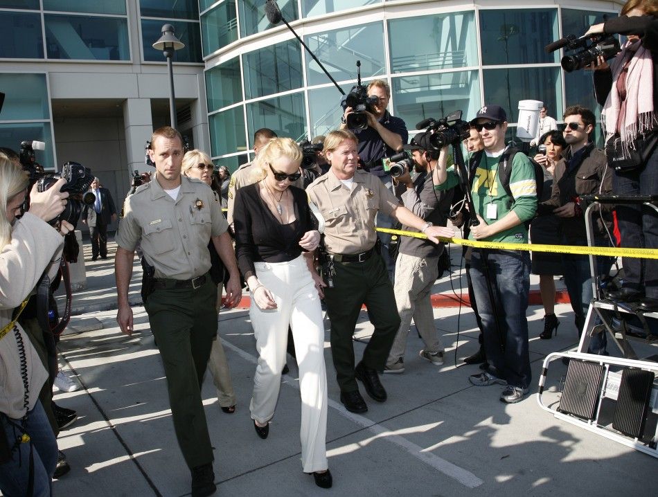 Actress Lindsay Lohan leaves court after a preliminary hearing in Los Angeles
