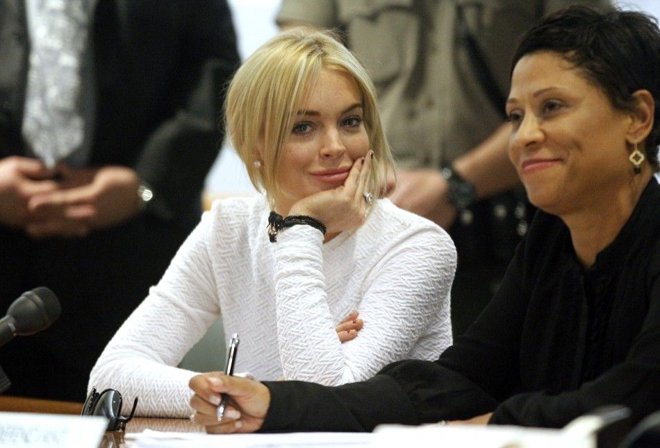 Actress Lohan and her attorney Holley appear in court as she pleads not guilty to a grand theft charge of stealing a 2,500 necklace from a jewelry store, in Los Angeles