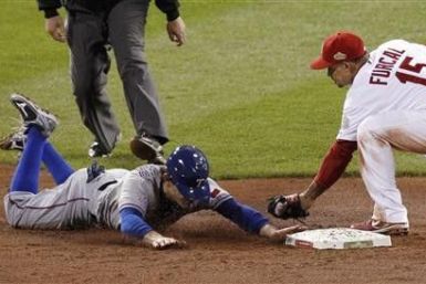 Texas Rangers second baseman Ian Kinsler steals second base on St. Louis Cardinals shortstop Rafael Furcal in the ninth inning in Game 2 of MLB&#039;s World Series baseball championship in St. Louis, Missouri