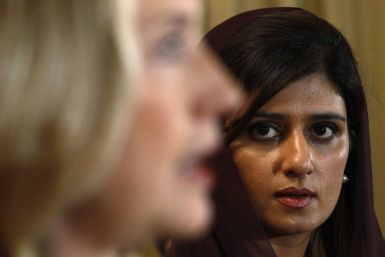U.S. Secretary of State Hillary Clinton speaks as Pakistan&#039;s Foreign Minister Hina Rabbani Khar listens during a joint press availability in Islamabad