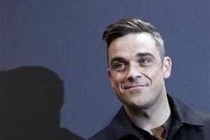 British singer Robbie Williams arrives on the red carpet for the German premiere of &#039;&#039;Cars 2&#039;&#039; in Munich