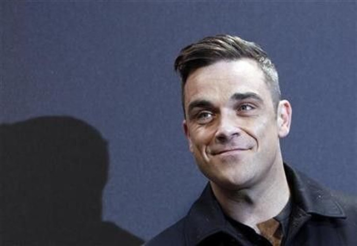 British singer Robbie Williams arrives on the red carpet for the German premiere of &#039;&#039;Cars 2&#039;&#039; in Munich