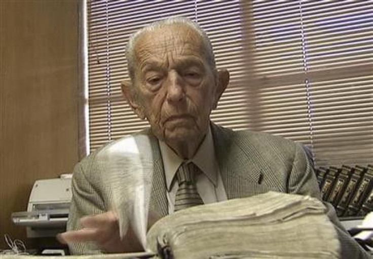 Harold Camping is seen reading the Bible in his office at Family Stations Inc. offices in Oakland, California in this still image from video