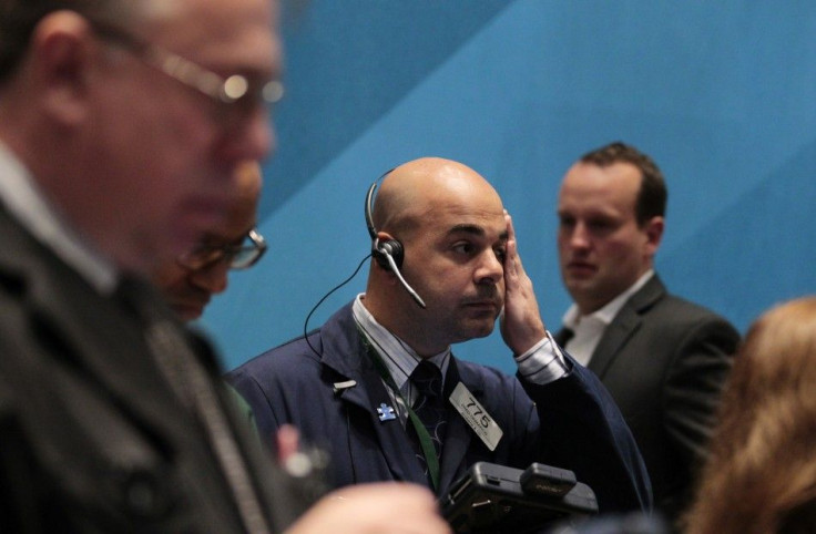 Traders work on the floor of the New York Stock Exchange