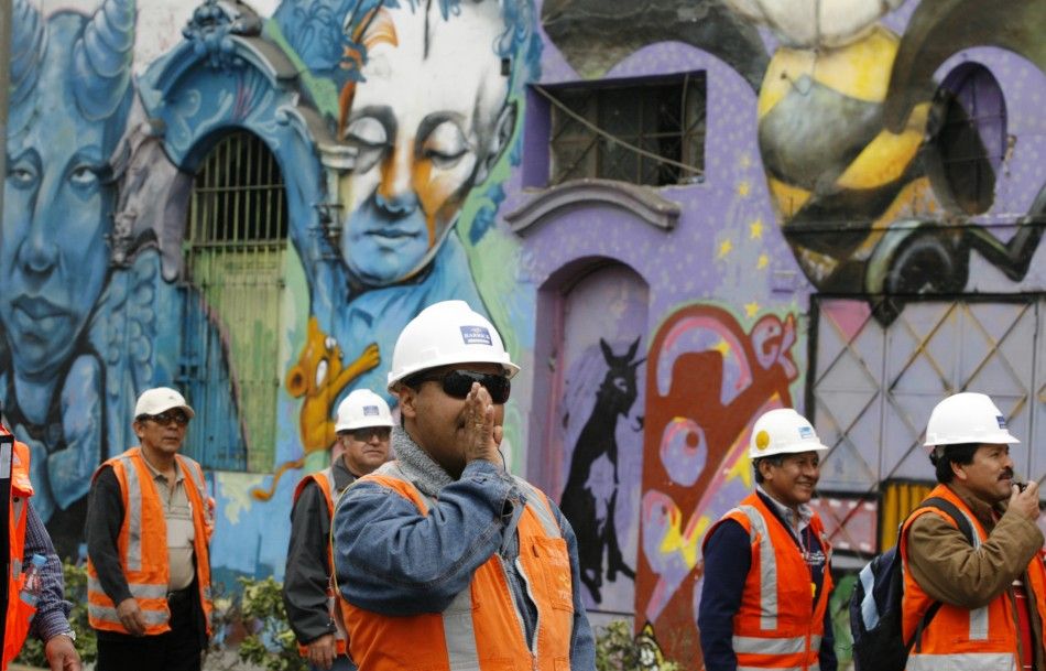 Cerro Verde miners protesting with graffiti in background