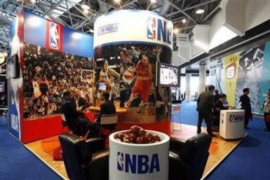 People visit the NBA stand at Sportel 2006 (International Sport Program Market for Television and New Media) in Monte Carlo