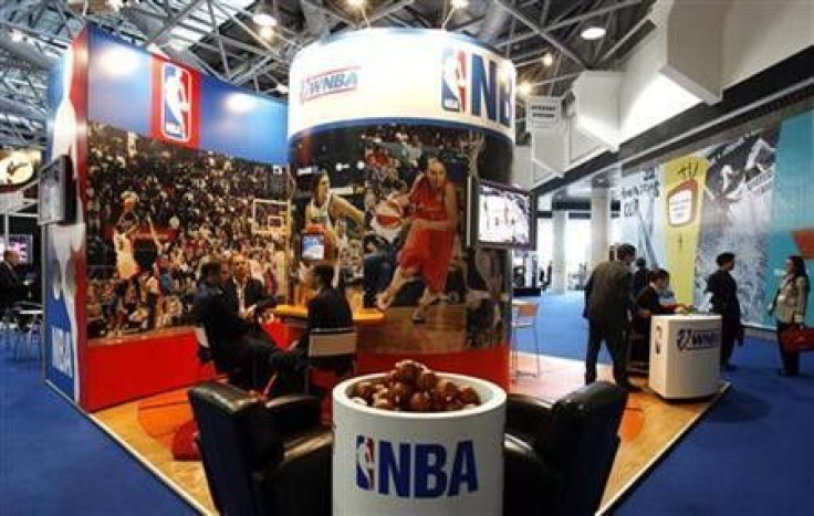 People visit the NBA stand at Sportel 2006 (International Sport Program Market for Television and New Media) in Monte Carlo