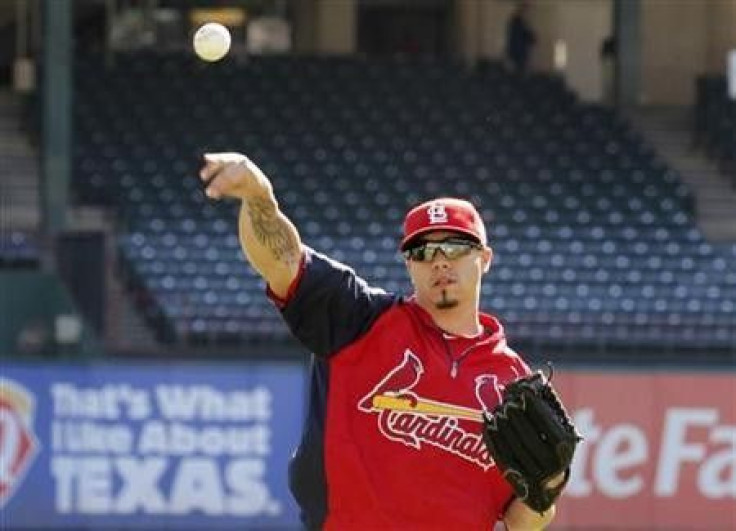 St. Louis Cardinals starting pitcher Kyle Lohse throws during practice a day prior to Game 3 of MLB's World Series baseball championship in Arlington, Texas