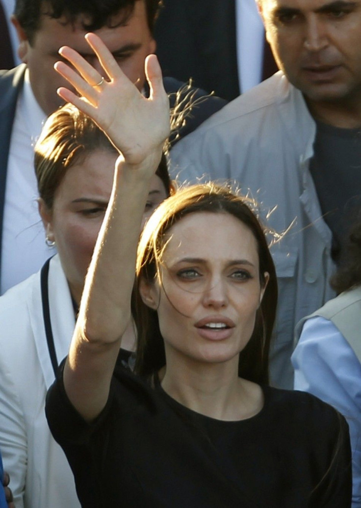 UNHCR Goodwill Ambassador Angelina Jolie waves as she leaves from a Syrian refugee camp in the southern Turkish town of Altinozu in Hatay province