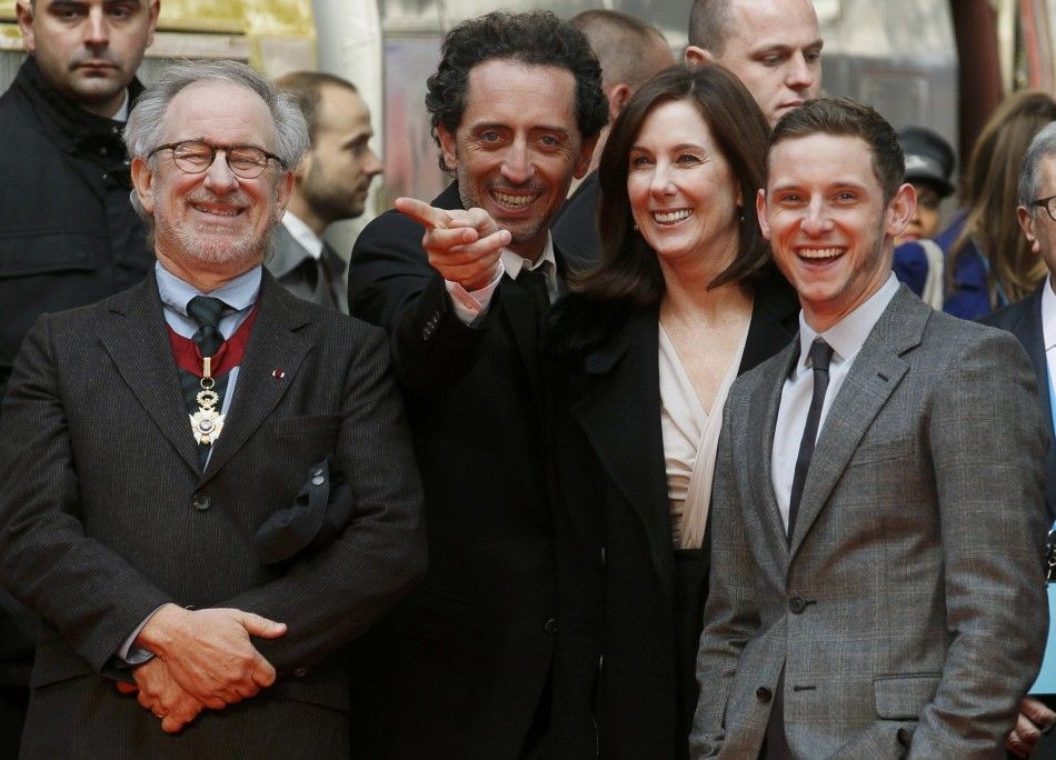 Director Spielberg, producer Kennedy and actors Elmaleh and Bell wait for the launch of a Tintin Thalys high-speed train in Brussels