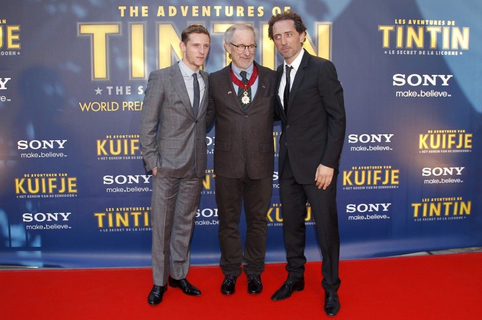 Director Steven Spielberg poses with actors Jamie Bell L and Gad Elmaleh R during a photocall ahead of the world premiere of the movie quotThe Adventures Of Tintin The Secret of The Unicornquot in Brussels October 22, 2011. 
