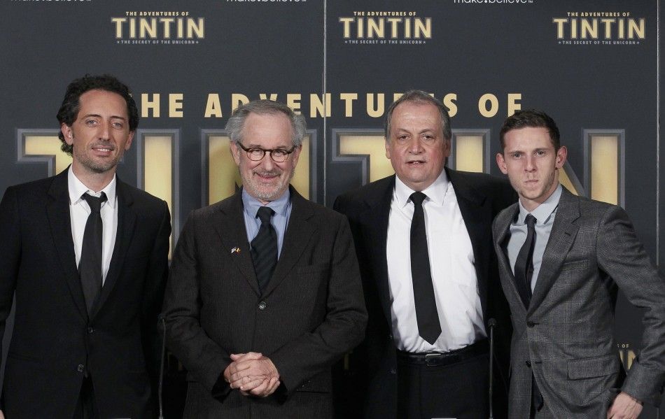 Director Steven Spielberg poses with actors Gad Elmaleh L and Jamie Bell R and senior visual effects artist Joe Letteri 2nd R during a photocall ahead of the world premiere of the movie quotThe Adventures Of Tintin The Secret of The Unicornquot