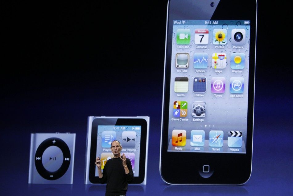 Apple Chief Executive Steve Jobs speaks on stage, with images of the iPod Shuffle L-R, iPod Nano and iPod Touch projected onscreen, at Apples music-themed September media event in San Francisco, California September 1, 2010. 