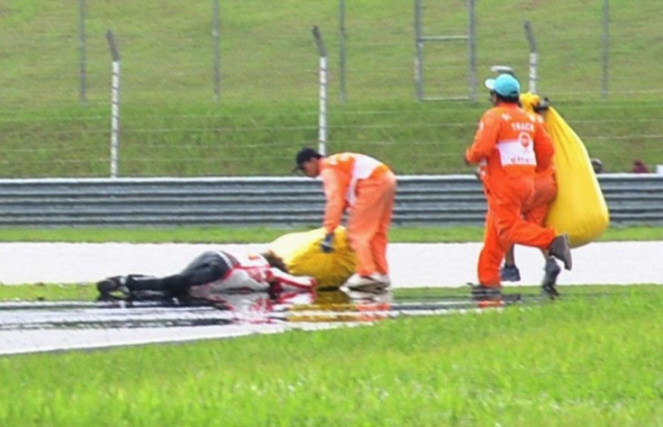 Honda MotoGP&#039;s Marco Simoncelli of Italy lies on the ground