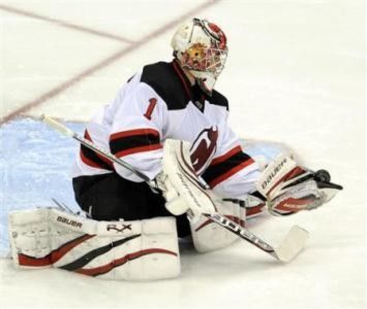 New Jersey Devils goalie Johan Hedberg makes a save against the Pittsburgh Penguins in the second period of their NHL hockey game in Pittsburgh, Pennsylvania