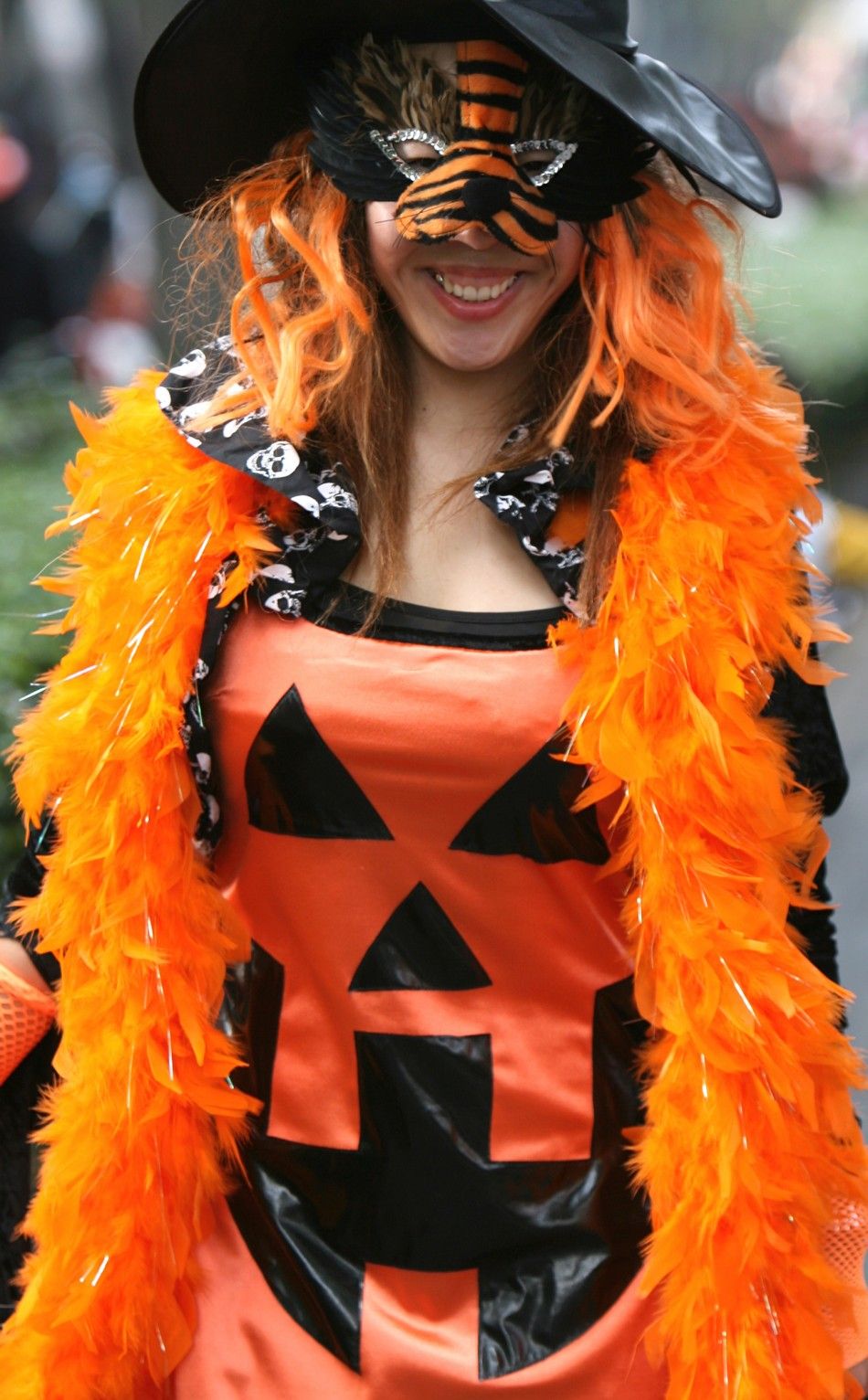 A woman dressed in a Halloween costume takes part in a parade in Tokyos Harajuku Omotesando district October 29, 2006. 