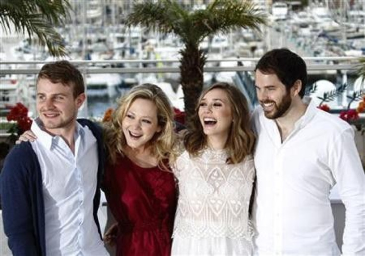 (L-R) Cast members Brady Corbet, Louisa Krause and Elisabeth Olsen pose with director Sean Durkin during a photocall for the film &#039;&#039;Martha Marcy May Marlene&#039;&#039; in competition for &#039;&#039; Un Certain Regard&#039;&#039; at the 64th Ca