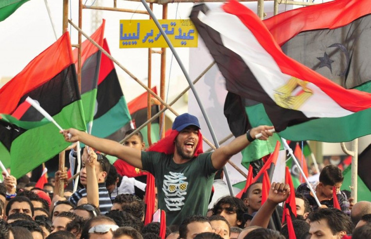 Libyan people with the Kingdom of Libya flags gather during celebrations for the liberation of Libya in Quiche, Benghazi October 23, 2011