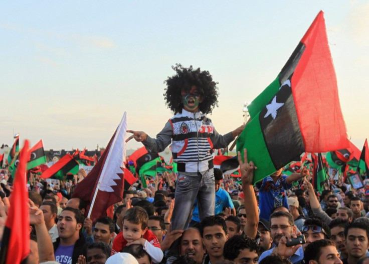 Libyan people with the Kingdom of Libya flags gather during celebrations for the liberation of Libya in Quiche, Benghazi October 23, 2011