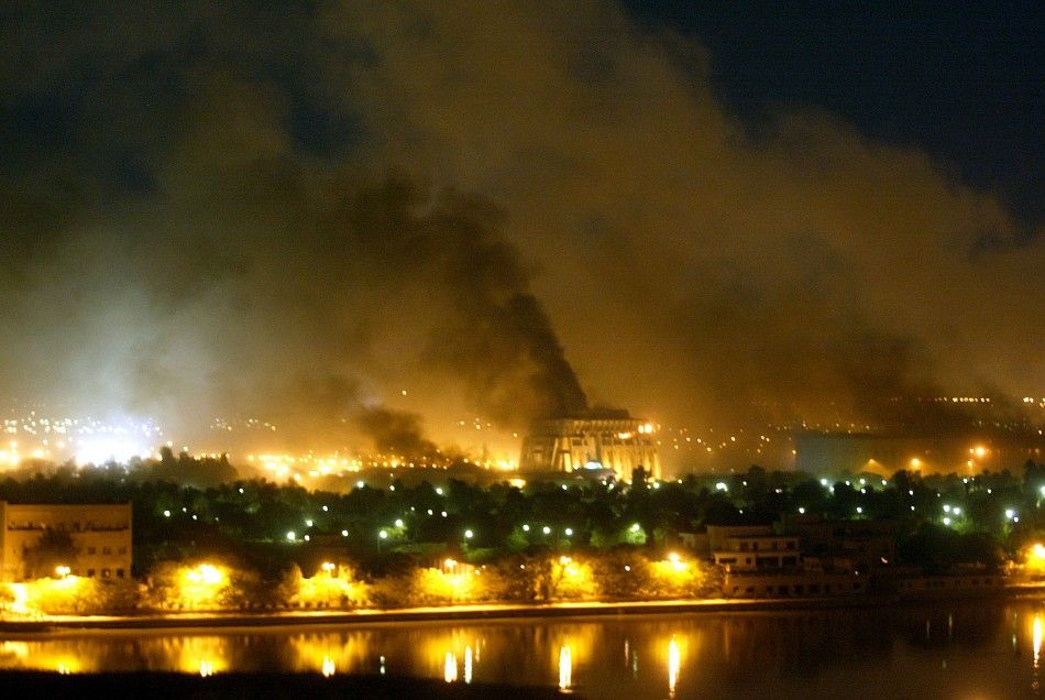 Smoke rises from an unidentified building as explosions rocks Baghdad during air strikes March 21, 2003. U.S.-led forces unleashed a devastating blitz on Baghdad on Friday night, triggering giant fireballs and deafening explosions and sending huge mushroo