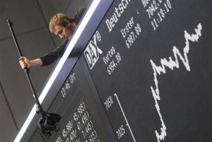 Photographer takes pictures of the DAX board at the Frankfurt stock exchange