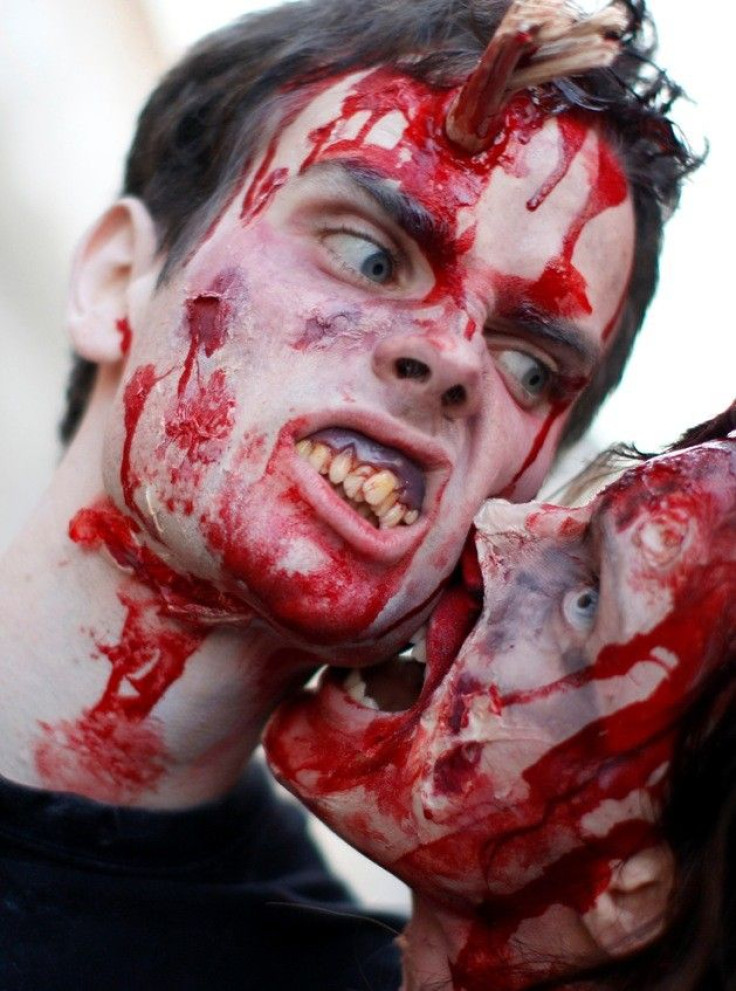 A woman and a man dressed as zombies 