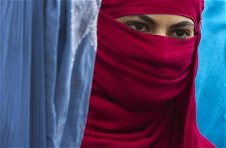 An Afghan woman attends a protest in Kabul