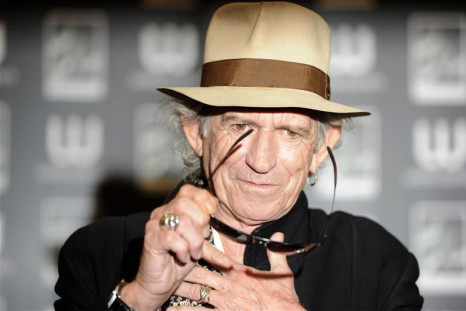 British musician Keith Richards poses for photographers before signing copies of his autobiography &quot;Life&quot; in London