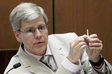 Anesthesiology expert Dr. Steven Shafer holds an intravenous line as he is cross examined by Ed Chernoff, a defense attorney for Dr. Conrad Murray during Murray&#039;s involuntary manslaughter trial in Los Angeles