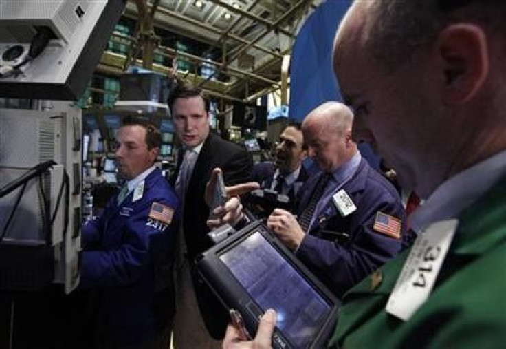 Traders work on the floor of the New York Stock Exchange October 21, 2011.