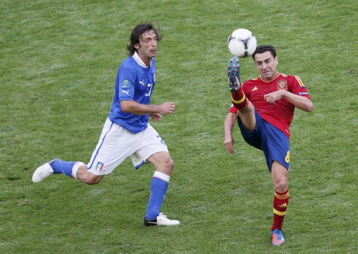 Andrea Pirlo (L) and Xavi