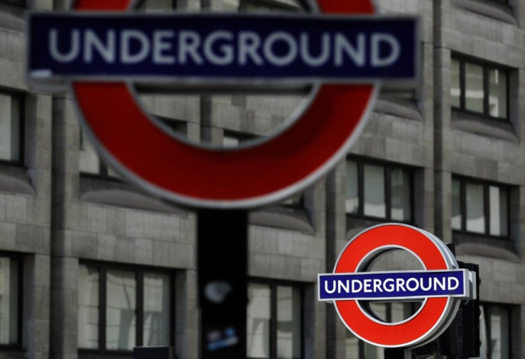 Signs for the London underground tube system are pictured in London