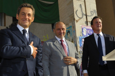 France&#039;s President Sarkozy, Britain&#039;s Prime Minister Cameron and NTC head Mustafa Abdul Jalil stand together in Benghazi