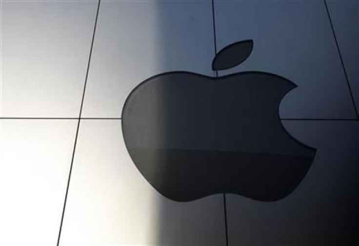 An Apple logo is seen with its light switched off to mourn the death of former Apple Inc Jobs, in Tokyo