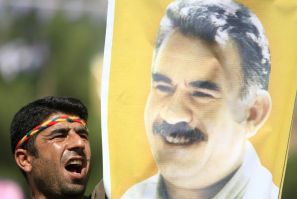 Kurdish man displays picture of PKK leader Abdullah Ocalan during in Diyarbakir