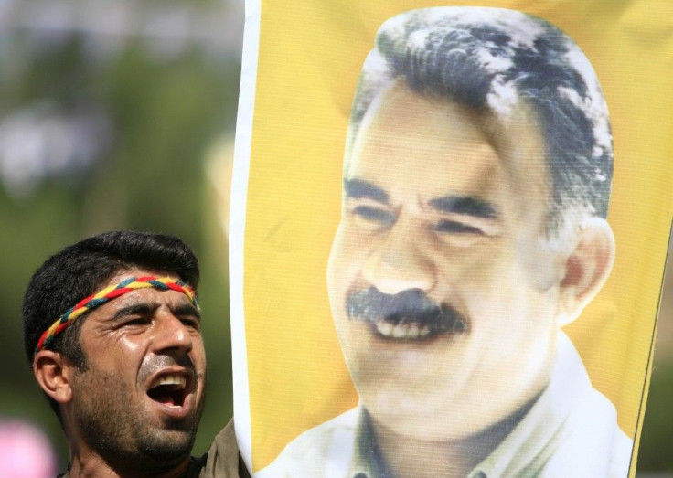 Kurdish man displays picture of PKK leader Abdullah Ocalan during in Diyarbakir
