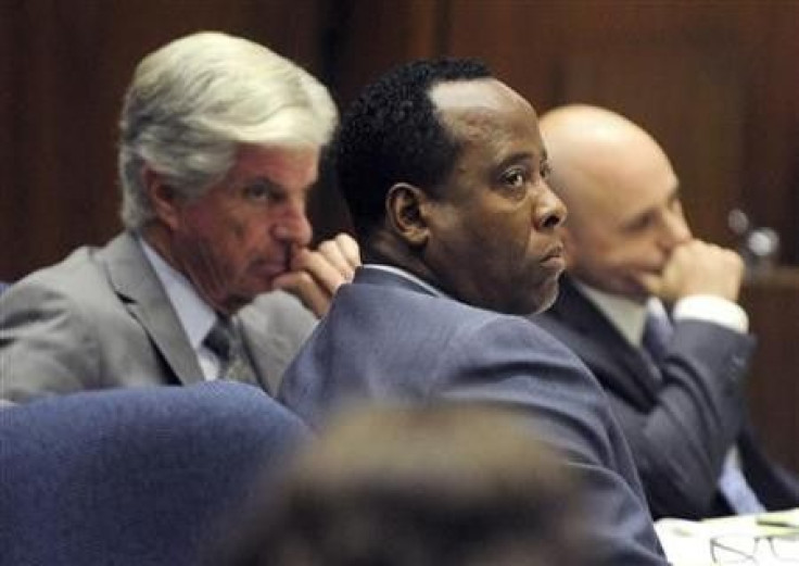 Dr. Conrad Murray (C) sits with his attorneys J. Michael Flanagan (L) and Nareg Gourjian (R) during Murray&#039;s involuntary manslaughter trial in the death of pop star Michael Jackson in Los Angeles
