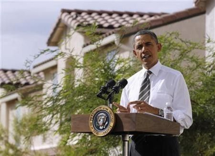 U.S. President Barack Obama speaks to the media in front of houses in a Las Vegas suburb
